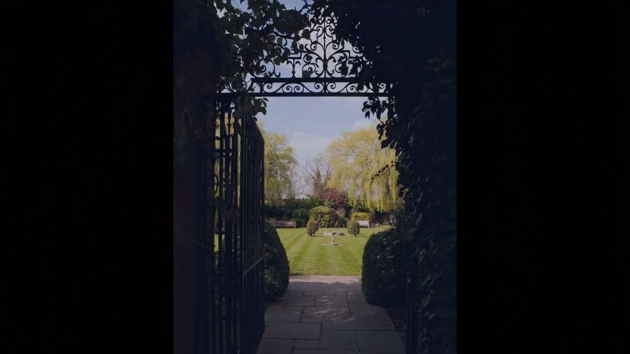 A blossom-lined avenue through the grounds of Chigwell Hall in spring